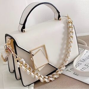 Elegant White Handbag with Gold Accents